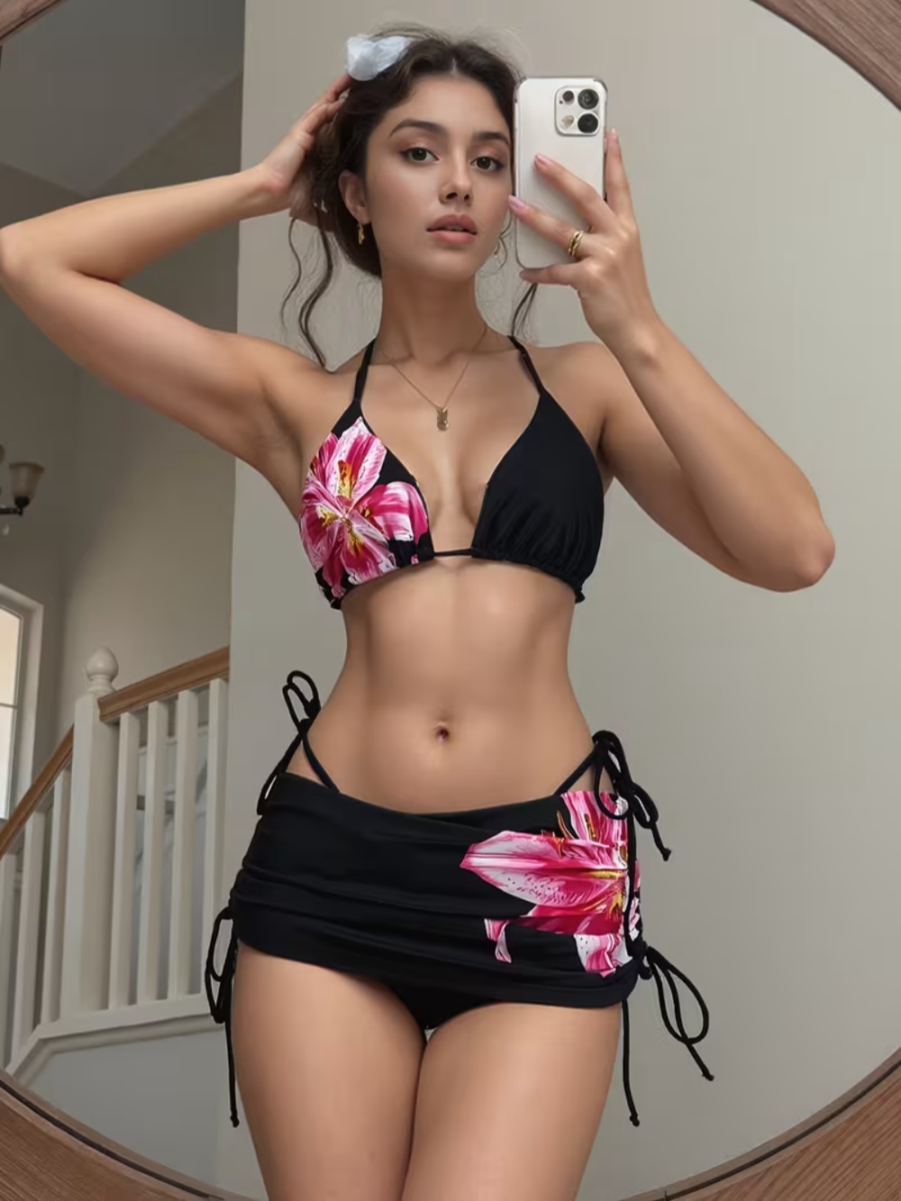 A woman taking a mirror selfie before chatting online