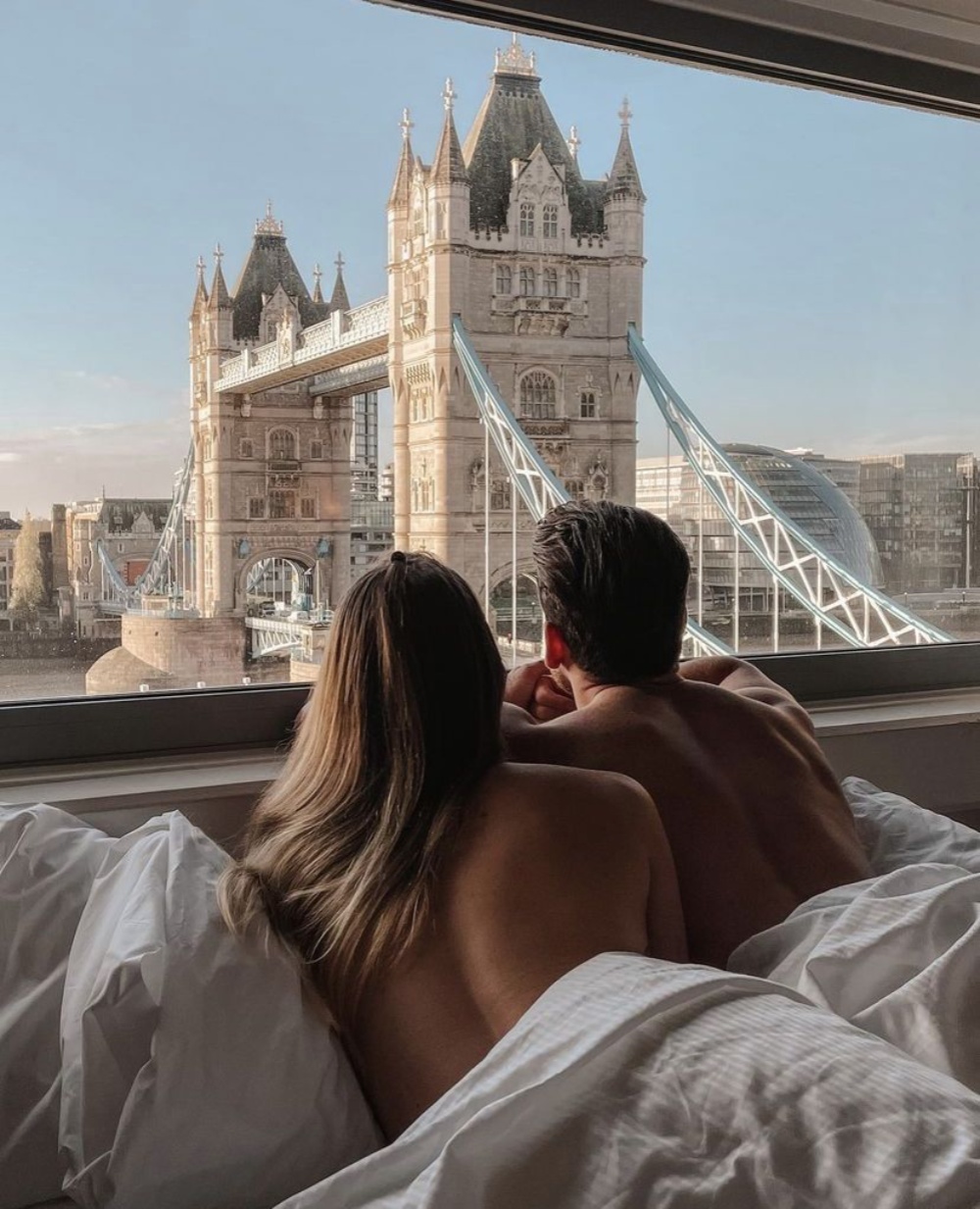 A couple looking toward Tower Bridge after meeting in person