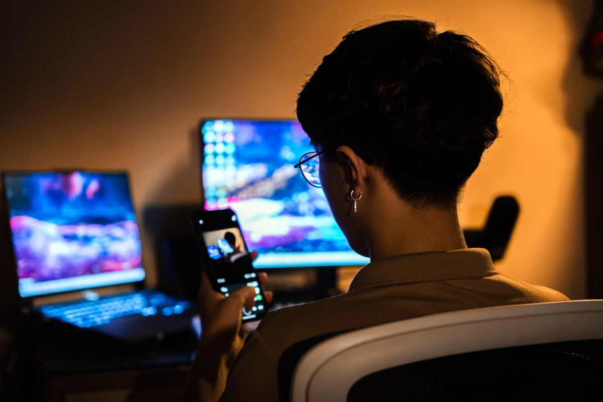 Person using phone and screens for online sex video chat and adult chat rooms
