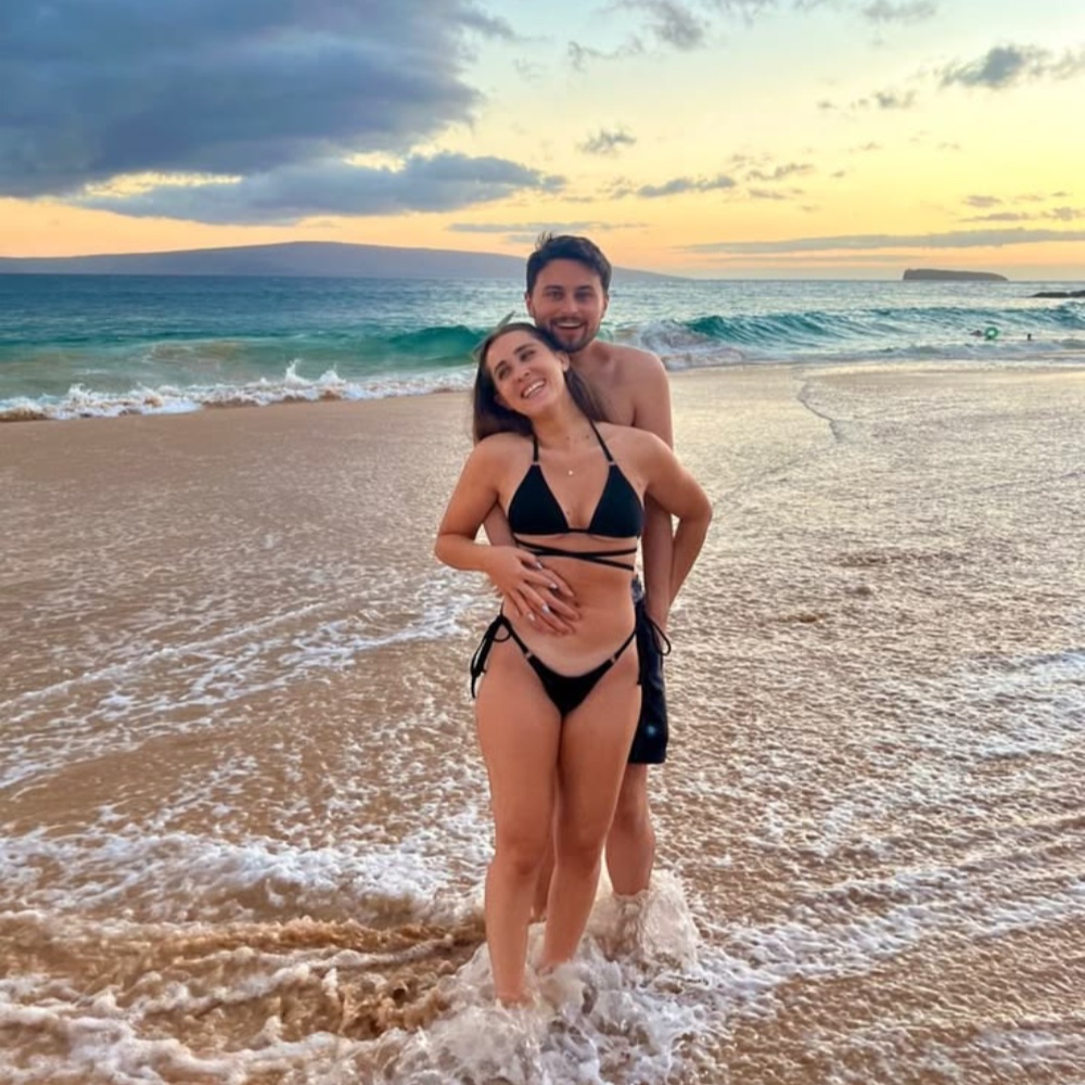Happy couple on beach at sunset representing offline confidence from sex chat sites practice