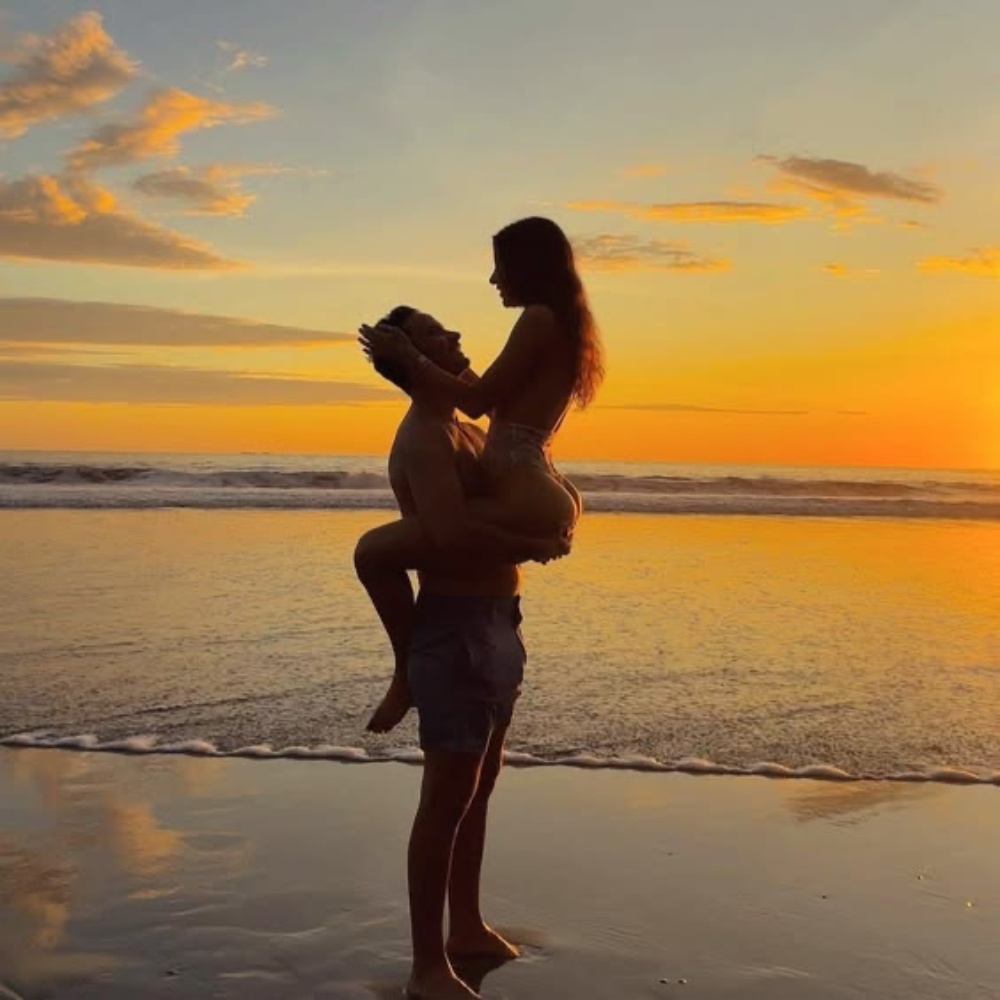 Couple on beach at sunset for sexy dances and adult MeetChats style content